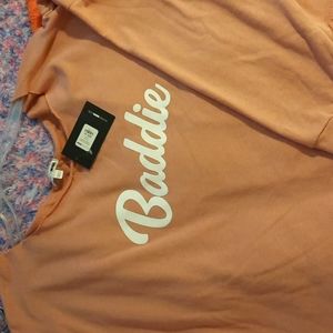 Pink sweatshirt says baddie